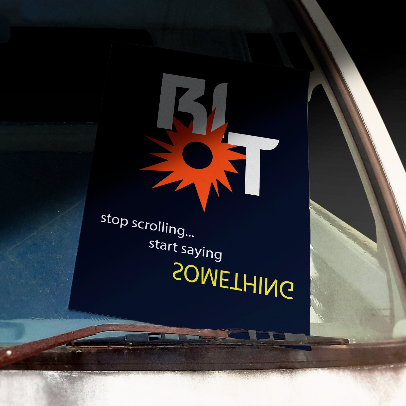 RIOT poster on windshield